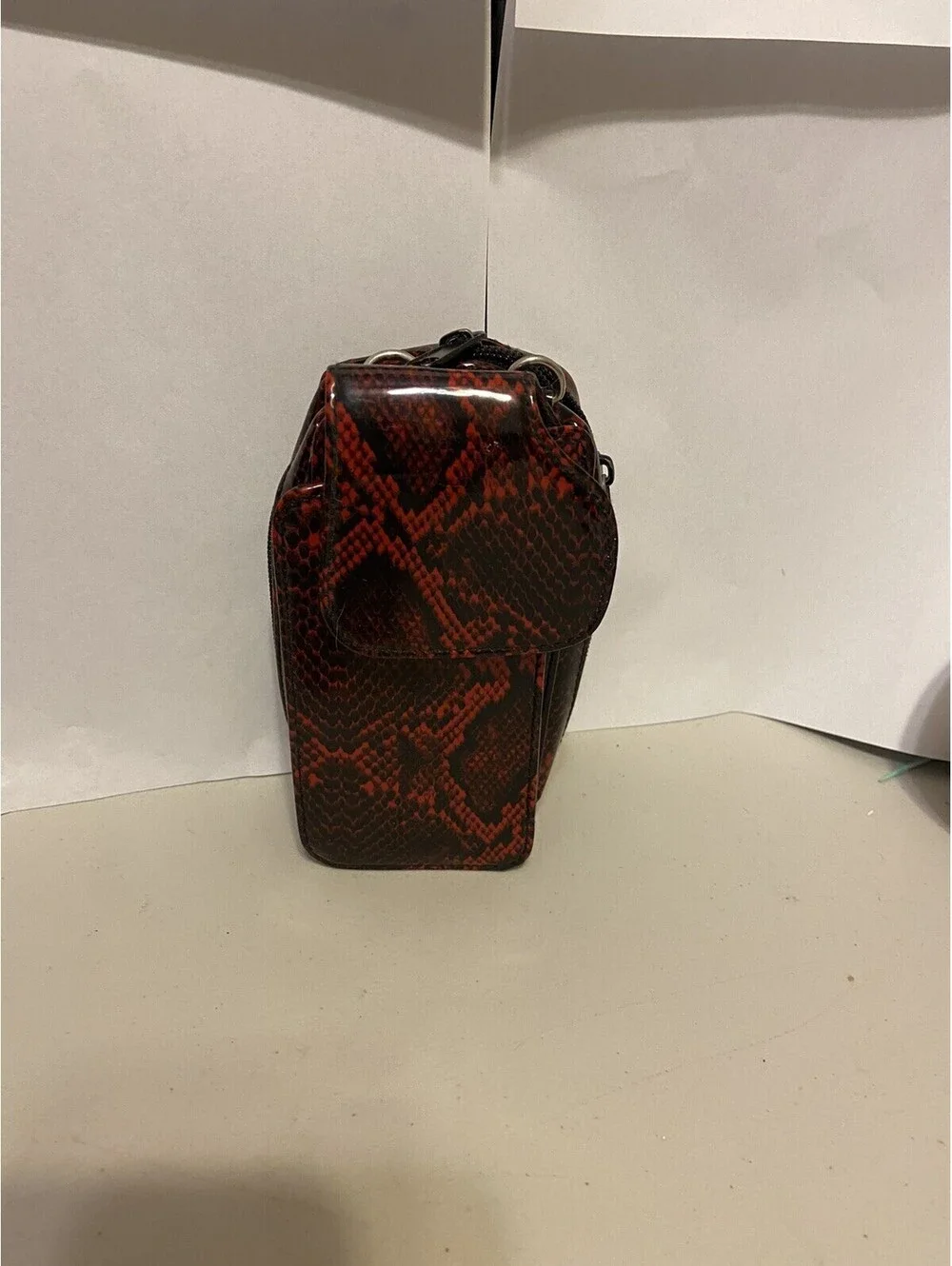 phone case red and black snakeskin look, vinyl. Fits I Phone.
